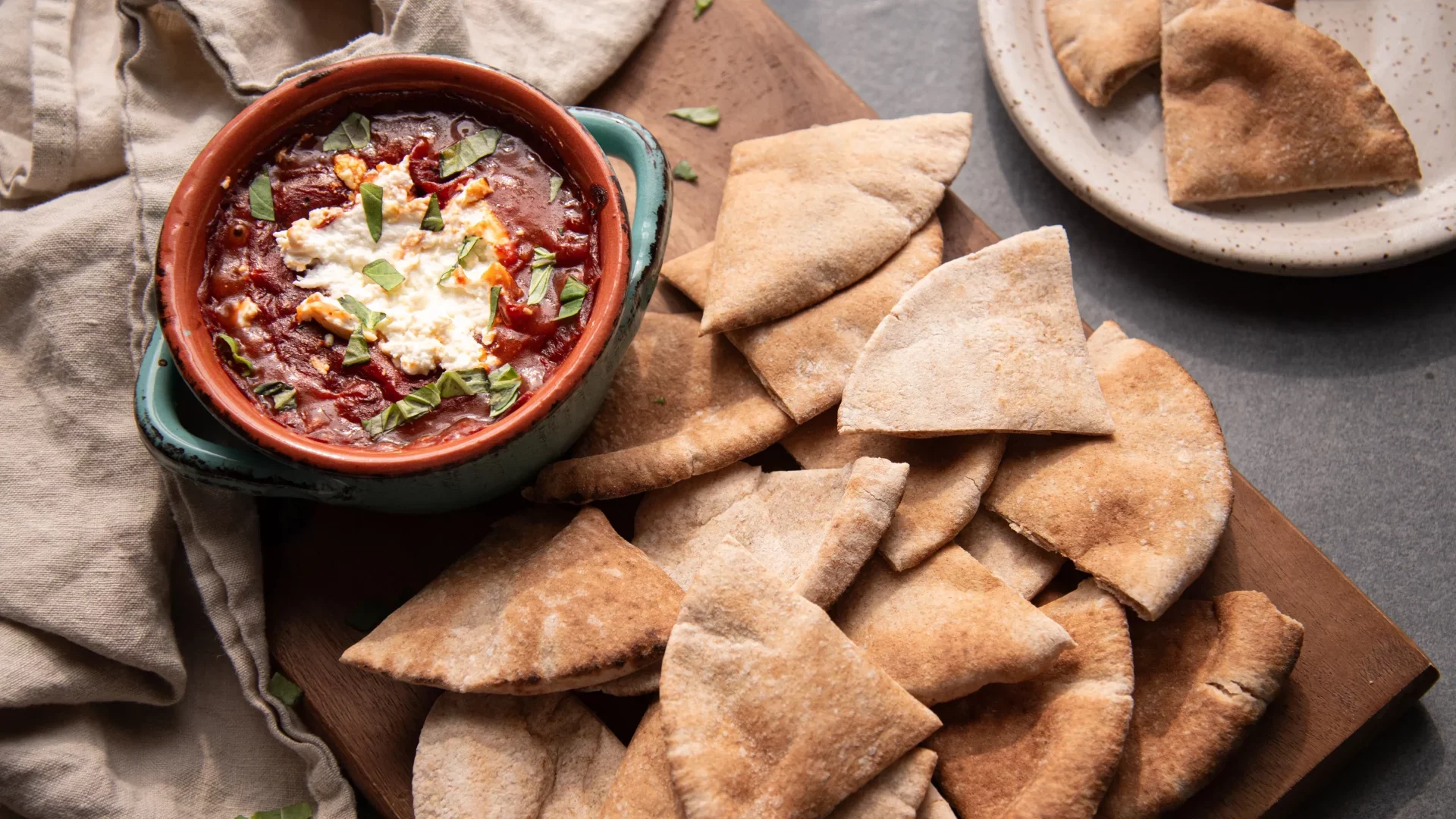 Goat Cheese Marinara dip with pita bread on the side